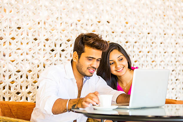 istock Indian couple sitting in cafe 539294971