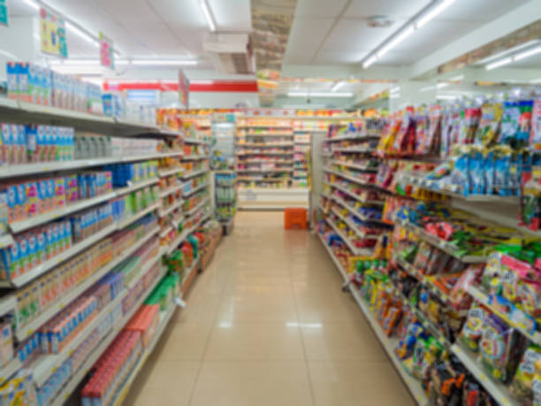 Blurry Supermarket The Shelves Convenience Store (7-11) at Thamai at Chanthaburi, Thailand convenience photos stock pictures, royalty-free photos & images