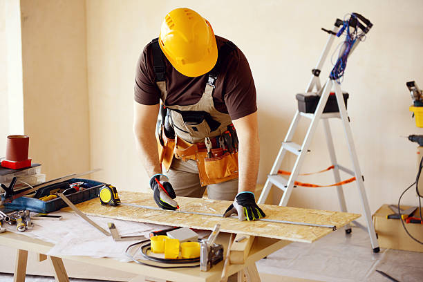 istock Male carpenter in working clothes in a construction workshop 539306005