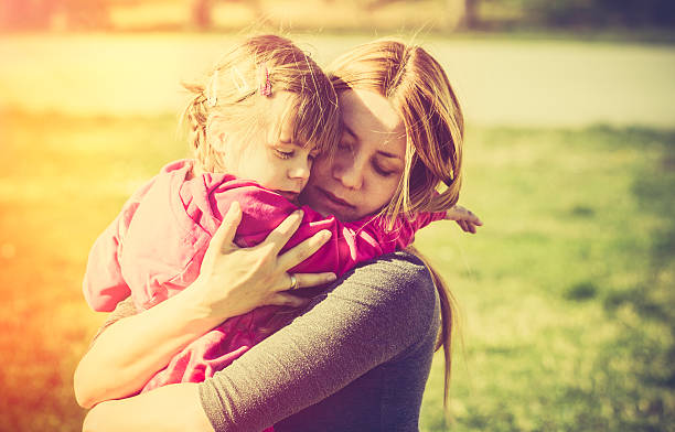 istock Mother embracing child in nature 539306197