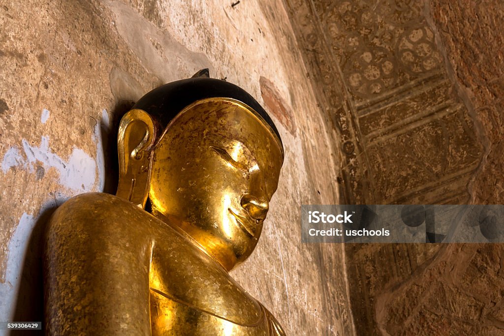 Golden Buddha and Frescoes inside a Temple  2015 Stock Photo