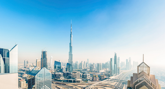 The new Dubai down town district with the Burj Khalifa rising above the ultra modern skyline.
