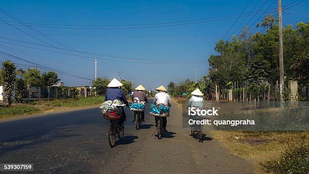 Four Vietnamese Women On Their Way To Work Stock Photo - Download Image Now - 2015, Active Seniors, Adult
