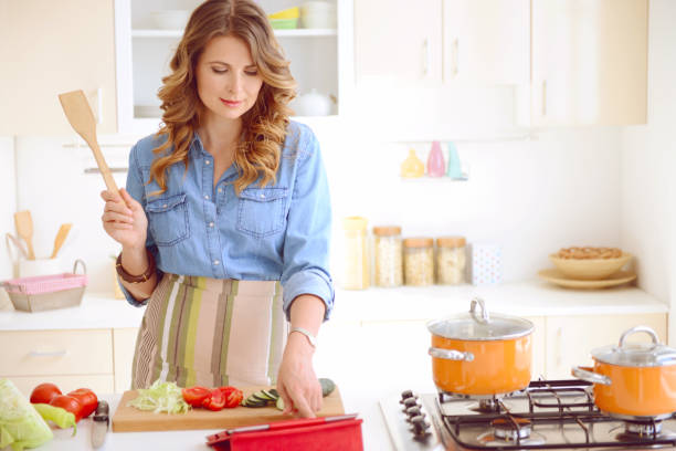 istock woman in the kitchen 539307611