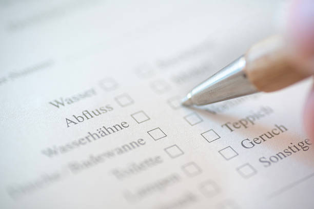 istock Customer survey on the repair on german with pen 539308201