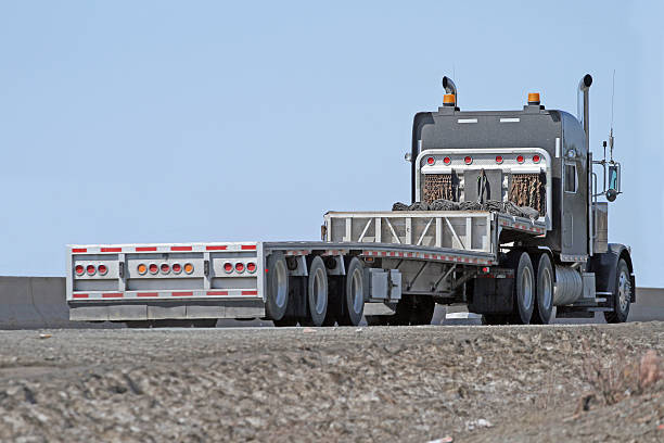 istock Semi Flatbed Trailer Truck With No Load Travelling Divided Highway 539308333
