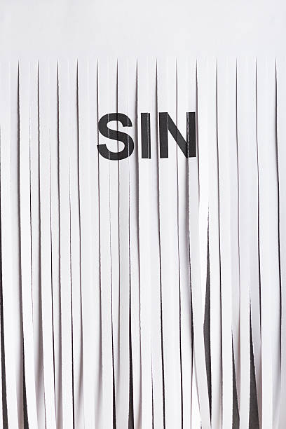 Shredded Sin on Paper Concept stock photo