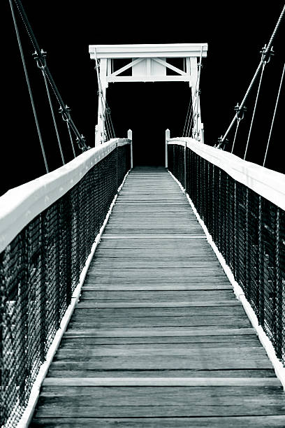 Gateshead, United Kingdom Visitors the Millenium bridge from Gateshead towards Newcastle.  This image shows the bridge with the Baltic in the background.