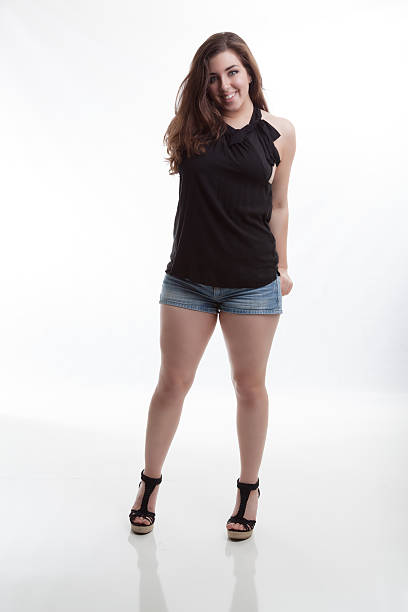 istock Summer Fashion Model Stands Smiling with Hands in Back Pockets 539326249