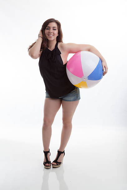 Fun Summer Fashion Model with Beach Ball and a Smile stock photo