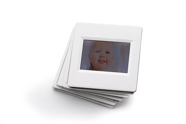 istock Stack old white photo slides with baby face isolated 539326733