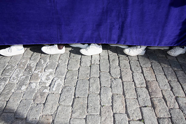 Close up of costaleros' feet underneath a float \
