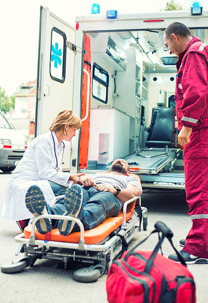 istock Medical emergency team helping injured man 539327545