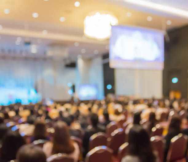 istock Blur row  of  audience  sitting  in auditorium with screen 539327552
