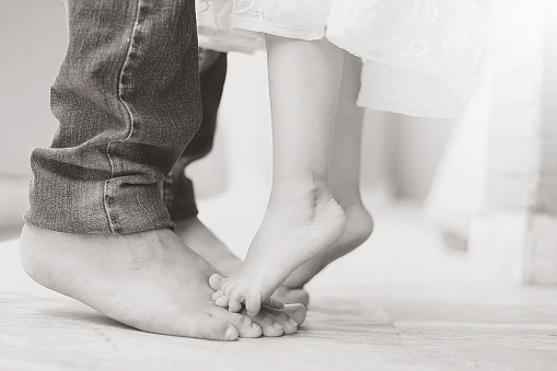 Dad dancing with his daughter