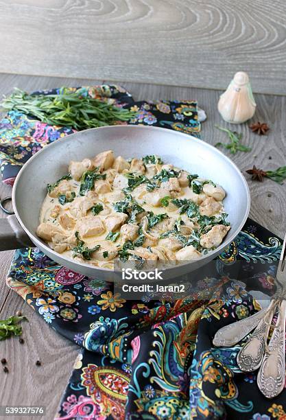 Chicken In A Creamy Sauce With Spinach And Tarragon Stock Photo - Download Image Now