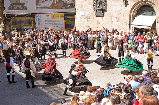 Santiago de Compostela, Spain - 2 June 2011: folk dancing in the square with traditional costumes and the public in Santiago, June 2011