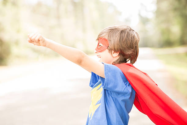 istock Little boy playing superhero outdoors. Pretend, dress up. 539329032