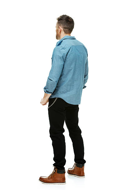 istock Rear view of hipster standing and looking away 539329398