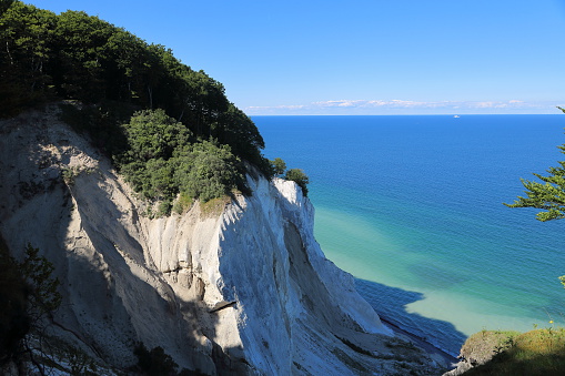 Tourist attraction in Sicily - Scala dei Turchi (Stair of the Turks) in Italy. Photo without tourists. Clear blue sky and clear water. Shot in summertime.