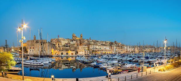 Panorama wth sailing boats on Senglea marina in Grand Bay, Valetta, Malta, on a quiet evening