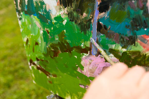 istock Painter finishing drawing sketch with a painbrush 539333270
