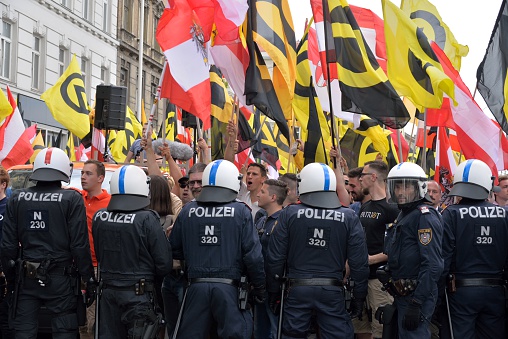 Vienna, Austria - June 11, 2016: Chain of special forces of the Austrian police against demonstrators of the identitarian movement at a demonstration in Vienna