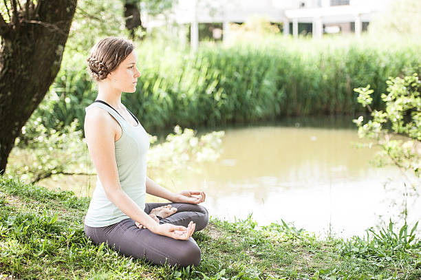 istock Woman meditating on a spring day outdoors 539336620