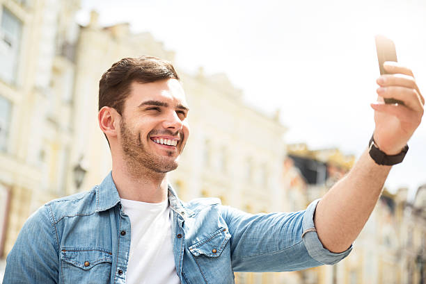 istock Positive man holding cell phone 539337558