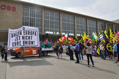 Vienna, Austria - June 11, 2016: Demonstration of the Austrian identitarian movement  in front of facade of vienna train station.