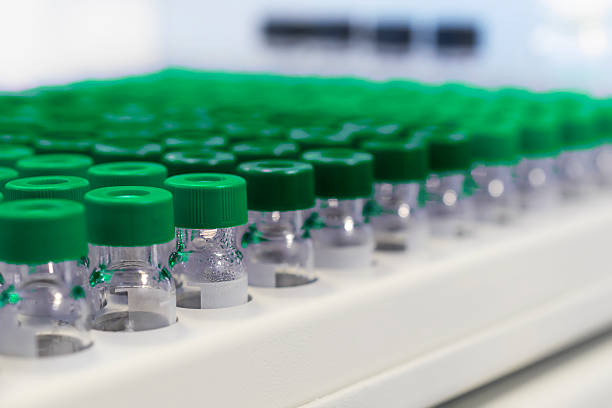 istock Rows of glass vials in the tray automatic liquid dispenser. 539337908