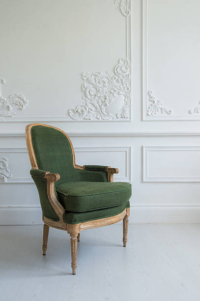 istock One classic armchair against a white wall and floor. Copy 539338968