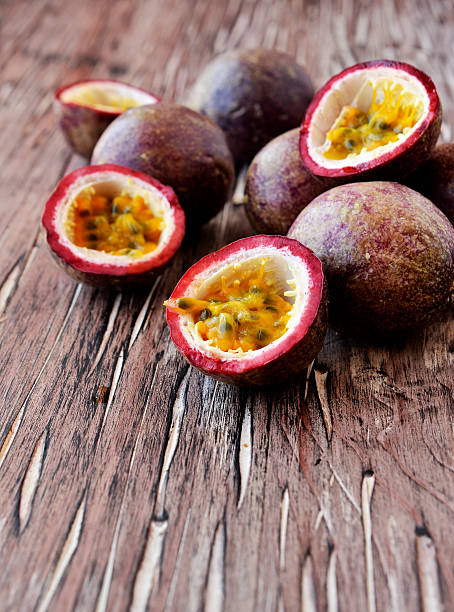 istock juicy fruit Granadilla with mint on a wooden table 539339340