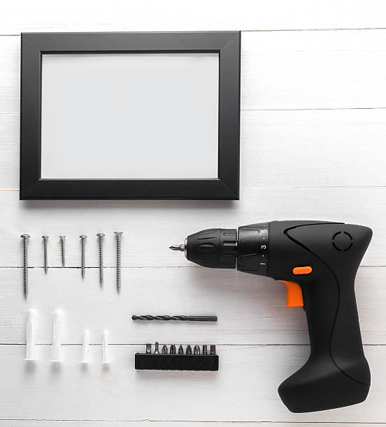 istock Driller with photo frame equipments. Photo frame. 539340748