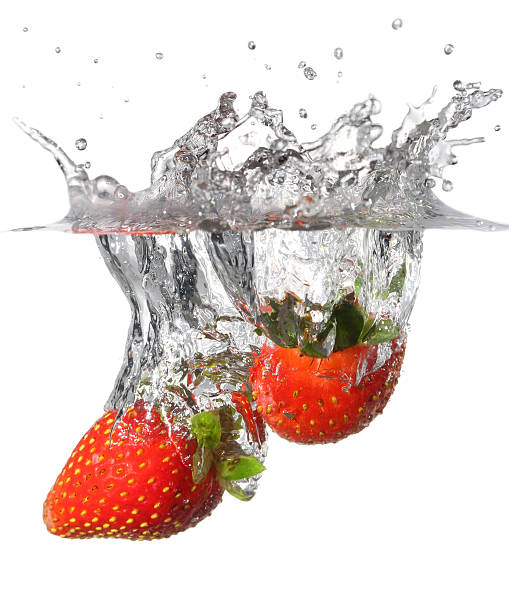 istock Splashing Strawberry into Water 539340750