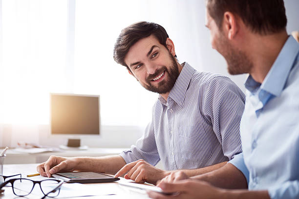 istock Positive colleagues sitting at the table 539341066