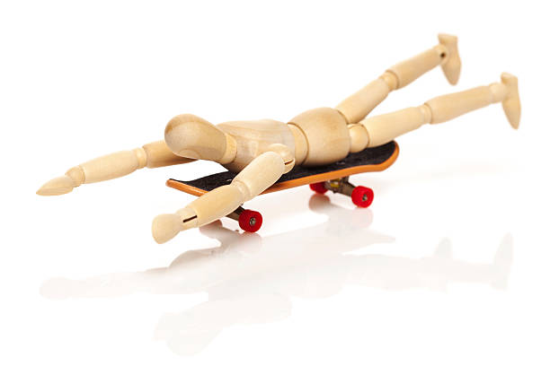 istock Wooden puppet  riding  skateboard 539341140