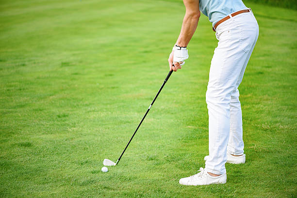 istock Close up of man playing golf on course 539344594