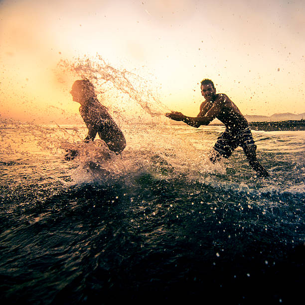 istock Friends having fun in the sea 539344693