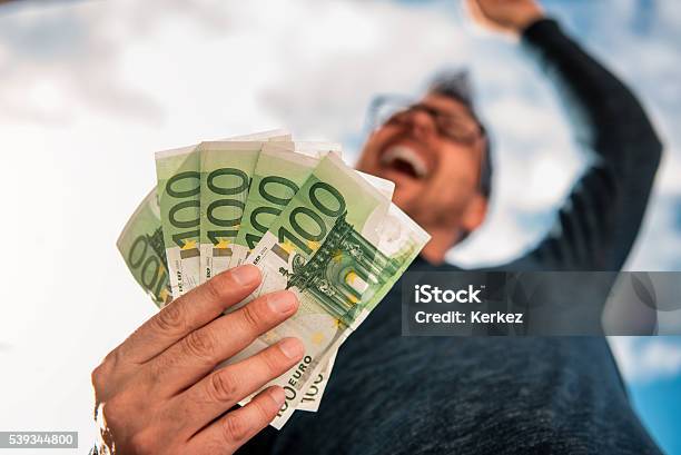 Man Holding Money Stock Photo - Download Image Now - Currency, European Union Currency, Euro Symbol
