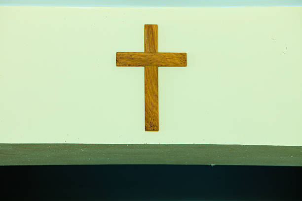istock Old wooden cross on wall 539344842