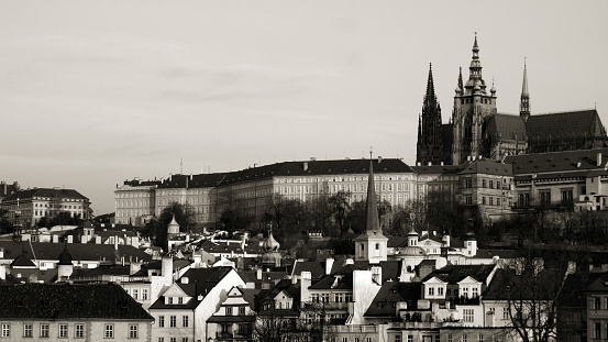 View of Hradcany district with its castle and the St. Vitus Cathedral at Prague at sunrise. 
