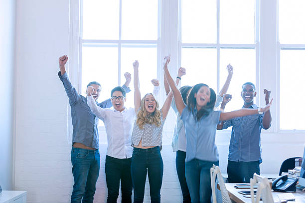 istock Group of young multi cultural business people celebrating. 539345247