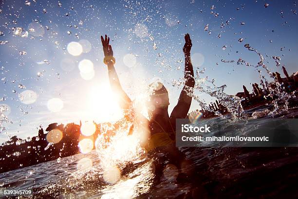 Young Woman Having Fun Stock Photo - Download Image Now - Jumping, Water, Splashing