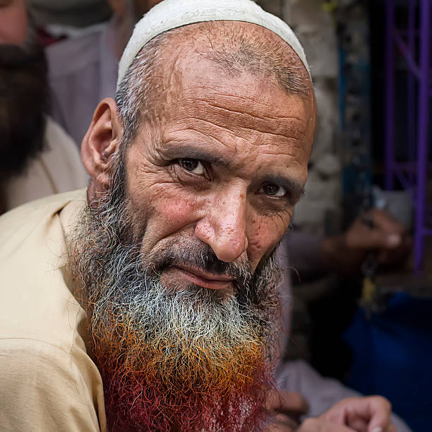 Lahore, Pakistan - April 26, 2013: Pashto refugee in Pakistan with henna dyed beard. According to UNCHR there are 1.6 million registered afghan refugees in Pakistan, and more than 1 million illegal (non-registered) ones. 