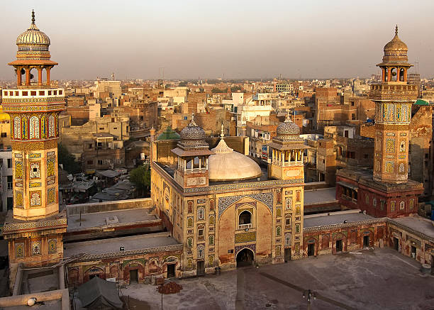 Wazir Khan mosque, Lahore, Pakistan Rooftop view from the Wazir Khan Mosque built in 1635. A masterpiece of the moghul architecture and a historic landmark in old Lahore lahore pakistan photos stock pictures, royalty-free photos & images