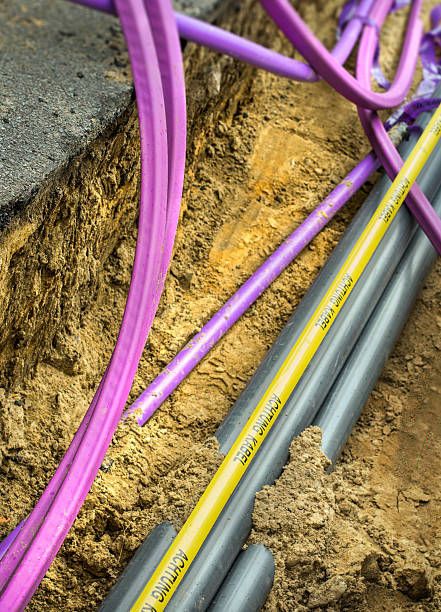 istock Fiberglass network under construction with pipes for laying optical fiber 539347049