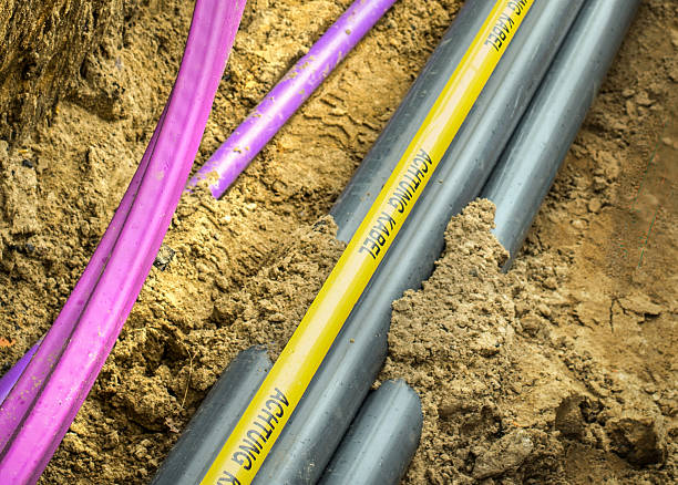 istock Fiberglass network under construction with pipes for laying optical fiber 539347051