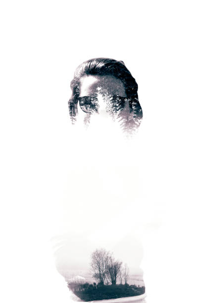 Double exposure portrait of woman. Trees and view of a forest at the background. Black and white photography.