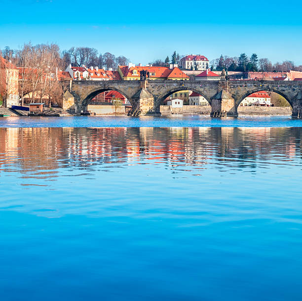 istock Prague, Charles bridge reflected in Vltava river 539347282